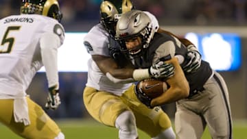 COLORADO SPRINGS, CO - NOVEMBER 12: Air Force Falcons running back Timothy McVey (33) runs past two Colorado State Rams defenders during the game between the Air Force Falcons and Colorado State Rams on November 12, 2016 in Colorado Springs, CO. Air Force beat Colorado State 49-46. (Photo by Bobby Stevens/Icon Sportswire via Getty Images)
