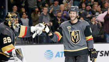 LAS VEGAS, NV - JANUARY 23: Vegas Golden Knights defenseman Colin Miller (6) bumps gloves with Vegas Golden Knights goaltender Marc-Andre Fleury (29) after scoring a goal during the second period of a regular season NHL game between the Columbus Blue Jackets and the Vegas Golden Knights at T-Mobile Arena Tuesday, Jan. 23, 2018, in Las Vegas, Nevada. (Photo by Marc Sanchez/Icon Sportswire via Getty Images)