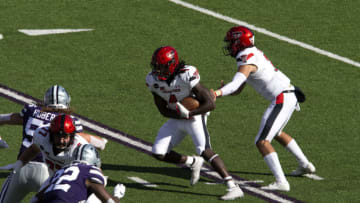 Oct 3, 2020; Manhattan, Kansas, USA; Texas Tech Red Raiders quarterback Henry Colombi (3) hands off to running back SaRodorick Thompson (4) during a game against the Kansas State Wildcats at Bill Snyder Family Football Stadium. Mandatory Credit: Scott Sewell-USA TODAY Sports
