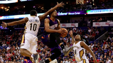Nov 4, 2016; New Orleans, LA, USA; Phoenix Suns forward TJ Warren (12) shoots as he is fouled by New Orleans Pelicans guard Langston Galloway (10) during the second half of a game at the Smoothie King Center. Mandatory Credit: Derick E. Hingle-USA TODAY Sports