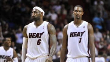 Apr 4, 2014; Miami, FL, USA; Miami Heat forward LeBron James (left) and center Chris Bosh (right) both react during the second half against the Minnesota Timberwolves at American Airlines Arena. The Minnesota Timberwolves won in 2 overtimes 122-121. Mandatory Credit: Steve Mitchell-USA TODAY Sports