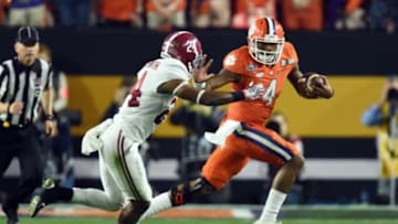 Jan 11, 2016; Glendale, AZ, USA; Clemson Tigers quarterback Deshaun Watson (4) runs against Alabama Crimson Tide defensive back Geno Matias-Smith (24) in the second quarter in the 2016 CFP National Championship at University of Phoenix Stadium. Mandatory Credit: Matt Kartozian-USA TODAY Sports