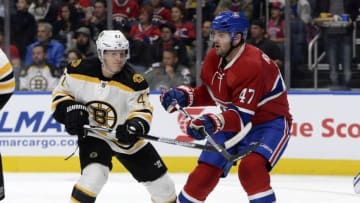 Oct 4, 2016; Quebec City, Quebec, CAN; Boston Bruins defenseman Torey Krug (47) and Montreal Canadiens forward Alexander Radulov (47) battle in front of the net during the second period of a preseason hockey game at Centre Videotron. Mandatory Credit: Eric Bolte-USA TODAY Sports