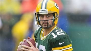 Sep 15, 2013; Green Bay, WI, USA; Green Bay Packers quarterback Aaron Rodgers (12) throws a pass during warmups prior to the game against the Washington Redskins at Lambeau Field. Mandatory Credit: Jeff Hanisch-USA TODAY Sports