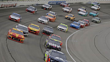 JOLIET, ILLINOIS - JUNE 30: Alex Bowman, driver of the #88 Axalta Chevrolet, leads the pack out of turn four following a restart during the Monster Energy NASCAR Cup Series Camping World 400 at Chicagoland Speedway on June 30, 2019 in Joliet, Illinois. (Photo by Jonathan Daniel/Getty Images)