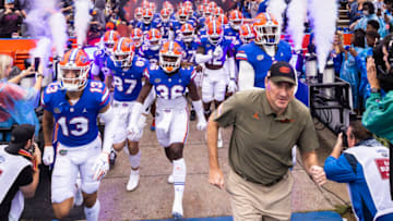 GAINESVILLE, FLORIDA - NOVEMBER 13: head coach Dan Mullen of the Florida Gators takes the field with his team before the start of a game against the Samford Bulldogs at Ben Hill Griffin Stadium on November 13, 2021 in Gainesville, Florida. (Photo by James Gilbert/Getty Images)