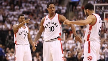 May 11, 2016; Toronto, Ontario, CAN; Toronto Raptors guard DeMar DeRozan (10) celebrates his basket with point guard Cory Joseph (6) and point guard Kyle Lowry (7) against the Miami Heat in game five of the second round of the NBA Playoffs at Air Canada Centre. The Raptors beat the Heat 99-91. Mandatory Credit: Tom Szczerbowski-USA TODAY Sports