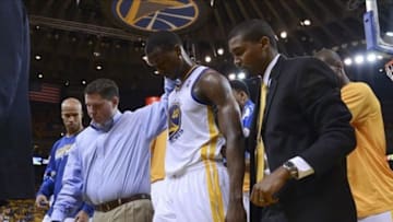 May 16, 2013; Oakland, CA, USA; Golden State Warriors small forward Harrison Barnes (40) is helped off the court after an injury during the second quarter in game six of the second round of the 2013 NBA Playoffs against the San Antonio Spurs at Oracle Arena. Mandatory Credit: Kyle Terada-USA TODAY Sports