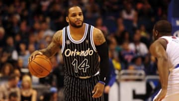 Feb 21, 2014; Orlando, FL, USA; Orlando Magic point guard Jameer Nelson (14) in the first half as the Knicks play the Magic at Amway Center. Mandatory Credit: David Manning-USA TODAY Sports