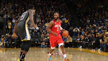 OAKLAND, CA - FEBRUARY 23: Chris Paul #3 of the Houston Rockets handles the ball against the Golden State Warriors on February 23, 2019 at ORACLE Arena in Oakland, California. NOTE TO USER: User expressly acknowledges and agrees that, by downloading and or using this photograph, User is consenting to the terms and conditions of the Getty Images License Agreement. Mandatory Copyright Notice: Copyright 2019 NBAE (Photo by Noah Graham/NBAE via Getty Images)