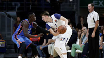 MADRID, SPAIN - OCTOBER 03: Victor Oladipo (L) of the Oklahoma City Thunder is in action against Luka Doncic (R) of Real Madrid during the basketball match between Oklahoma City Thunder and Real Madrid as part of the 2016 Global Games at the Barclaycard Center in Madrid, Spain on October 03, 2016. (Photo by Burak Akbulut/Anadolu Agency/Getty Images)