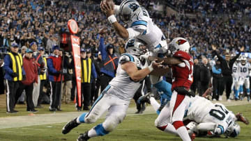 Jan 24, 2016; Charlotte, NC, USA; Carolina Panthers quarterback Cam Newton (1) dives for a touchdown during the third quarter against the Arizona Cardinals in the NFC Championship football game at Bank of America Stadium. Mandatory Credit: Jeremy Brevard-USA TODAY Sports