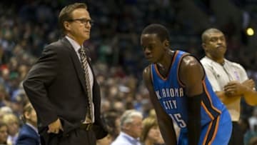 Nov 11, 2014; Milwaukee, WI, USA; Oklahoma City Thunder head coach Scott Brooks talks with guard Reggie Jackson (15) during the third quarter against the Milwaukee Bucks at BMO Harris Bradley Center. Mandatory Credit: Jeff Hanisch-USA TODAY Sports