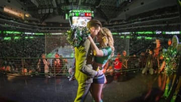 Mar 4, 2016; Dallas, TX, USA; Dallas Stars fan Nicholas Bozich proposes to his girlfriend and Stars ice girl Melissa Lauren during the game at the American Airlines Center. The Stars defeat the Devils 4-2. Mandatory Credit: Jerome Miron-USA TODAY Sports