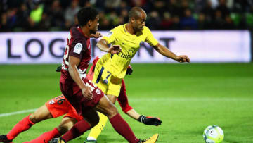 METZ, FRANCE - SEPTEMBER 08: Lucas Moura of Paris Saint-Germain Football Club or PSG scores past Goalkeeper, Eiji Kawashima and Matthieu Udol of Metz FC during the Ligue 1 match between Metz and Paris Saint Germain or PSG held at Stade Saint-Symphorien on September 8, 2017 in Metz, France. (Photo by Dean Mouhtaropoulos/Getty Images)