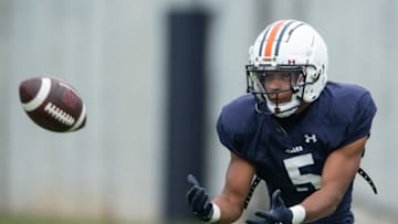 Auburn football wide receiver Jay Fair (5) catches a pass during Auburn Tigers football practice at the Woltosz Football Performance Center at in Auburn, Ala., on Monday, April 3, 2023.