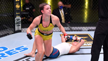 LAS VEGAS, NEVADA - MAY 30: In this handout image provided by the UFC, Mackenzie Dern celebrates after her submission victory over Hannah Cifers in their strawweight fight during the UFC Fight Night event at UFC APEX on May 30, 2020 in Las Vegas, Nevada. (Photo by Jeff Bottari/Zuffa LLC via Getty Images)
