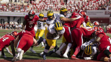 Oct 8, 2022; Bloomington, Indiana, USA; Michigan Wolverines running back Blake Corum (2) sneaks through a hole in the line for a touchdown during the first quarter agains the Indiana Hoosiers at Memorial Stadium. Mandatory Credit: Marc Lebryk-USA TODAY Sports