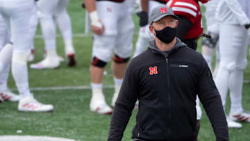 Dec 12, 2020; Lincoln, Nebraska, USA; Nebraska Cornhuskers coach Scott Frost looks to the video board as a tribute to the teamÕs seniors is played before a game against the Minnesota Golden Gophers at Memorial Stadium. Mandatory Credit: Dylan Widger-USA TODAY Sports