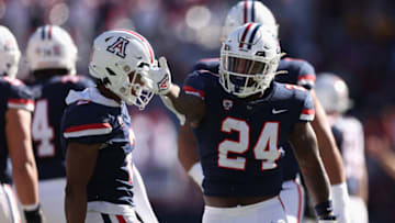 TUCSON, ARIZONA - NOVEMBER 25: Running back Jonah Coleman #24 of the Arizona Wildcats reacts to a first down against the Arizona State Sun Devils during the first half of the NCAAF game at Arizona Stadium on November 25, 2022 in Tucson, Arizona. This year's game is the 96th annual Territorial Cup match between Arizona rival schools. (Photo by Christian Petersen/Getty Images)