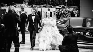 VENICE, ITALY - AUGUST 31: (EDITORS NOTE: Image converted in black and white) Bradley Cooper and Lady Gaga arrive at the red carpet ahead of the 'A Star Is Born' screening during the 75th Venice Film Festival at Sala Grande on August 31, 2018 in Venice, Italy. (Photo by Andreas Rentz/Getty Images)