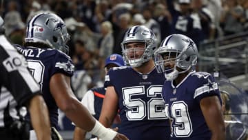 ARLINGTON, TX - NOVEMBER 05: Joe Looney #73 and Connor Williams #52 of the Dallas Cowboys celebrate the first quarter touchdown by Amari Cooper #19 against the Tennessee Titans at AT&T Stadium on November 5, 2018 in Arlington, Texas. (Photo by Ronald Martinez/Getty Images)