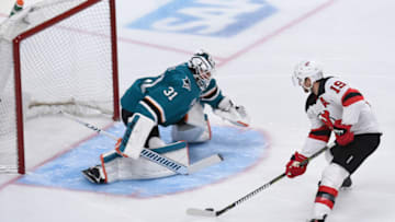 SAN JOSE, CA - DECEMBER 10: New Jersey Devils Center Travis Zajac (19) has a shot blocked by San Jose Sharks Goalie Martin Jones (31) during the National Hockey League game between the New Jersey Devils and the San Jose Sharks on December 10, 2018 at the SAP Center in San Jose, CA. (Photo by Cody Glenn/Icon Sportswire via Getty Images)