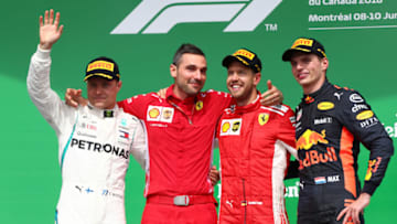MONTREAL, QC - JUNE 10: Top three finishers Sebastian Vettel of Germany and Ferrari, Valtteri Bottas of Finland and Mercedes GP and Max Verstappen of Netherlands and Red Bull Racing celebrate on the podium during the Canadian Formula One Grand Prix at Circuit Gilles Villeneuve on June 10, 2018 in Montreal, Canada. (Photo by Dan Istitene/Getty Images)