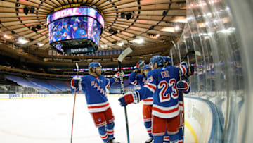 NEW YORK, NEW YORK - FEBRUARY 01: The New York Rangers celebrate after a goal scored by Kevin Rooney #17 (not pictured) during the second period against the Pittsburgh Penguins at Madison Square Garden on February 01, 2021 in New York City. (Photo by Sarah Stier/Getty Images)