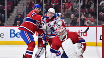 MONTREAL, QC - FEBRUARY 27: Ben Chiarot #8 of the Montreal Canadiens and Jesper Fast #17 of the New York Rangers battle for position near goaltender Carey Price #31 during the third period at the Bell Centre on February 27, 2020 in Montreal, Canada. The New York Rangers defeated the Montreal Canadiens 5-2. (Photo by Minas Panagiotakis/Getty Images)
