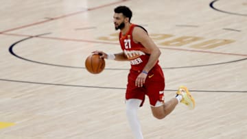 DENVER, COLORADO - FEBRUARY 23: Jamal Murray #27 of the Denver Nuggets brings the ball down the court against the Portland Trailblazers in the second quarter at Ball Arena on February 23, 2021 in Denver, Colorado. NOTE TO USER: User expressly acknowledges and agrees that, by downloading and or using this photograph, User is consenting to the terms and conditions of the Getty Images License Agreement. (Photo by Matthew Stockman/Getty Images)