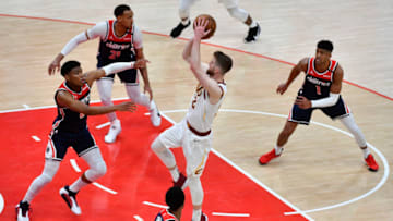 May 14, 2021; Washington, District of Columbia, USA; Cleveland Cavaliers forward Dean Wade (32) shoots over Washington Wizards forward Rui Hachimura (8) during the third quarter at Capital One Arena. Mandatory Credit: Brad Mills-USA TODAY Sports