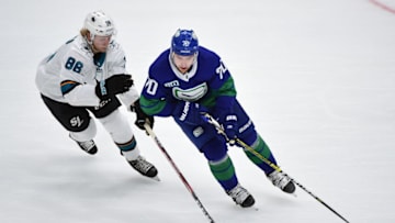 Jan 18, 2020; Vancouver, British Columbia, CAN; Vancouver Canucks forward Tanner Pearson (70) controls the puck against San Jose Sharks forward Joachim Blichfeld (86) during the third period at Rogers Arena. Mandatory Credit: Anne-Marie Sorvin-USA TODAY Sports