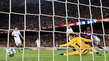 Barcelona's French forward Ousmane Dembele (R) scores a goal during the Spanish league football match between FC Barcelona and Sevilla FC at the Camp Nou stadium in Barcelona on October 6, 2019. (Photo by Josep LAGO / AFP) (Photo by JOSEP LAGO/AFP via Getty Images)