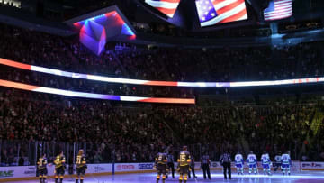 LAS VEGAS, NV - FEBRUARY 23: Members of the Vegas Golden Knights and the Vancouver Canucks and referees stand on the ice as the American national anthem is performed before a game at T-Mobile Arena on February 23, 2018 in Las Vegas, Nevada. The Golden Knights won 6-3. (Photo by Ethan Miller/Getty Images)