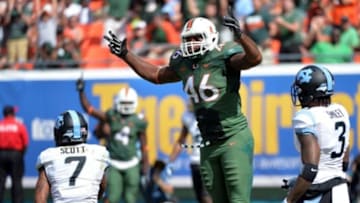 Nov 1, 2014; Miami Gardens, FL, USA; Miami Hurricanes tight end Clive Walford (46) reacts after a touchdown past North Carolina Tar Heels safety Tim Scott (7) during the first half at Sun Life Stadium. Mandatory Credit: Steve Mitchell-USA TODAY Sports