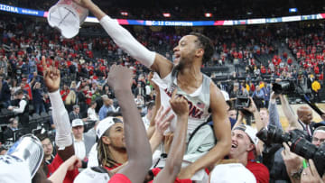 LAS VEGAS, NV - MARCH 10: Parker Jackson-Cartwright #0 of the Arizona Wildcats celebrates with his team during the championship game of the Pac-12 basketball tournament at T-Mobile Arena on March 10, 2018 in Las Vegas, Nevada. The Wildcats won 75-61. (Photo by Leon Bennett/Getty Images)