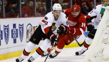 Feb 10, 2016; Detroit, MI, USA; Ottawa Senators right wing Mark Stone (61) skates with the puck skates with the puck chased by Detroit Red Wings center Gustav Nyquist (14) in the first period at Joe Louis Arena. Mandatory Credit: Rick Osentoski-USA TODAY Sports
