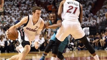Apr 20, 2016; Miami, FL, USA; Miami Heat guard Goran Dragic (7) dribbles the ball around Charlotte Hornets guard Kemba Walker (15) in game two of the first round of the NBA Playoffs during the second quarter at American Airlines Arena. Mandatory Credit: Steve Mitchell-USA TODAY Sports