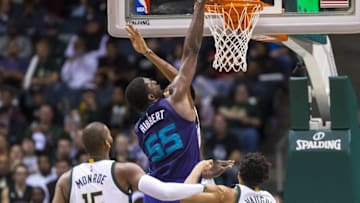 Oct 26, 2016; Milwaukee, WI, USA; Charlotte Hornets center Roy Hibbert (55) dunks as Milwaukee Bucks center Greg Monroe (15) and guard Rashad Vaughn (20) look on during the third quarter at BMO Harris Bradley Center. Mandatory Credit: Jeff Hanisch-USA TODAY Sports