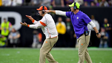 NEW ORLEANS, LOUISIANA - JANUARY 13: Head coach Dabo Swinney of the Clemson Tigers and defensive coordinator Brent Venables communicate with the team during the second quarter of the College Football Playoff National Championship game at the Mercedes Benz Superdome on January 13, 2020 in New Orleans, Louisiana. The LSU Tigers topped the Clemson Tigers, 42-25. (Photo by Alika Jenner/Getty Images)