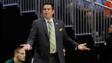 Mar 20, 2014; Orlando, FL, USA; Manhattan Jaspers head coach Steve Masiello reacts against the Louisville Cardinals during the first half of a men