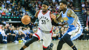 Oct 3, 2016; Calgary, Alberta, CAN; Toronto Raptors forward Terrence Ross (31) dribbles the ball under pressure from Denver Nuggets forward Wilson Chandler (21) during the first quarter at Scotiabank Saddledome. Mandatory Credit: Sergei Belski-USA TODAY Sports