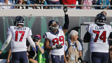 Nov 13, 2016; Jacksonville, FL, USA; Houston Texans tight end Stephen Anderson (89) celebrates a touchdown as tackle Chris Clark (74) and quarterback Brock Osweiler (17) approach during the second half of a football game against the Jacksonville Jaguars at EverBank Field. The Texans won 24-21. Mandatory Credit: Reinhold Matay-USA TODAY Sports