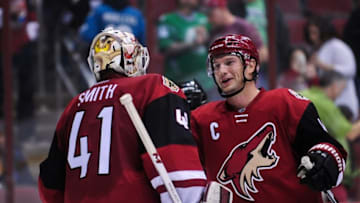 Mar 17, 2016; Glendale, AZ, USA; Arizona Coyotes right wing Shane Doan (19) celebrates with goalie Mike Smith (41) after beating the San Jose Sharks 3-1 at Gila River Arena. Mandatory Credit: Matt Kartozian-USA TODAY Sports