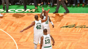 BOSTON, MA - APRIL 28: Terry Rozier #12 of the Boston Celtics and Al Horford #42 of the Boston Celtics high-five after the game against the Milwaukee Bucks in Game Seven of the 2018 NBA Playoffs on April 28, 2018 at the TD Garden in Boston, Massachusetts. NOTE TO USER: User expressly acknowledges and agrees that, by downloading and or using this photograph, User is consenting to the terms and conditions of the Getty Images License Agreement. Mandatory Copyright Notice: Copyright 2018 NBAE (Photo by Jesse D. Garrabrant/NBAE via Getty Images)