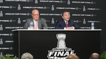 BOSTON, MASSACHUSETTS - MAY 27: (L-R) Deputy commissioner Bill Daly and Commissioner Gary Bettman of the National Hockey League speak with the media prior to Game One of the 2019 NHL Stanley Cup Final at TD Garden on May 27, 2019 in Boston, Massachusetts. (Photo by Bruce Bennett/Getty Images)