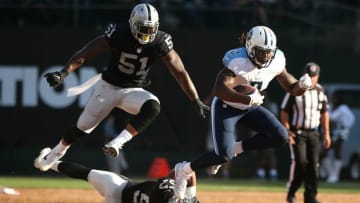 Aug 27, 2016; Oakland, CA, USA; Tennessee Titans running back Derrick Henry (2) runs for a first down past Oakland Raiders linebacker Bruce Irvin (51) in the second quarter at Oakland Alameda Coliseum. Mandatory Credit: Cary Edmondson-USA TODAY Sports