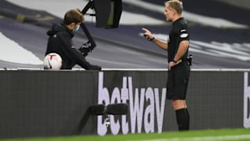LONDON, ENGLAND - NOVEMBER 01: Referee Graham Scott checks VAR. (Photo by Mike Hewitt/Getty Images)