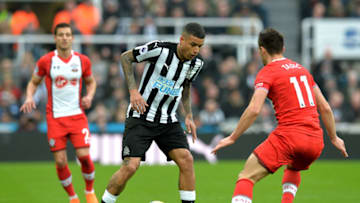 NEWCASTLE UPON TYNE, ENGLAND - MARCH 10: Kenedy of Newcastle United is challenged by Dusan Tadic of Southampton during the Premier League match between Newcastle United and Southampton at St. James Park on March 10, 2018 in Newcastle upon Tyne, England. (Photo by Mark Runnacles/Getty Images)